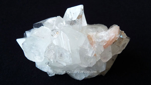 Clear Apophyllite Cluster with Peach Stilbite Inclusion