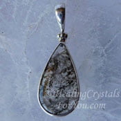 Pyrolusite included in Quartz